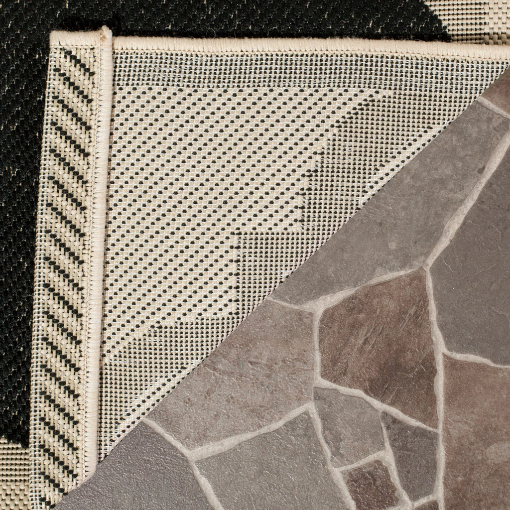 Black Beige Quatrefoil Indoor/Outdoor Area Rug N636360